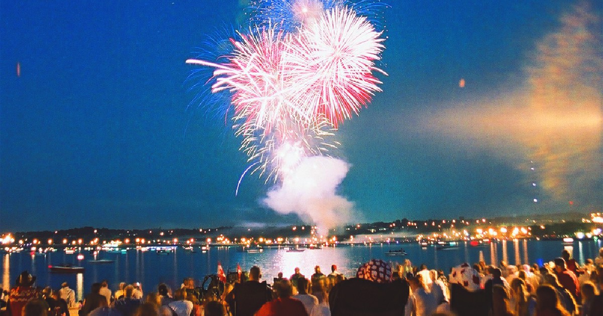 Group of people watching fireworks during Canada Day